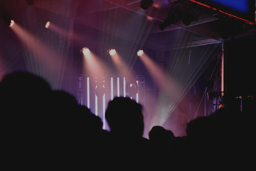 Auditorium stage with dramatic spotlights for a speaking event