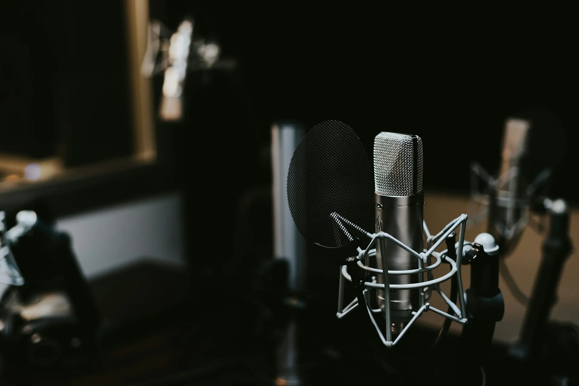 Professional studio microphone with warm lighting for Sent With Purpose podcast